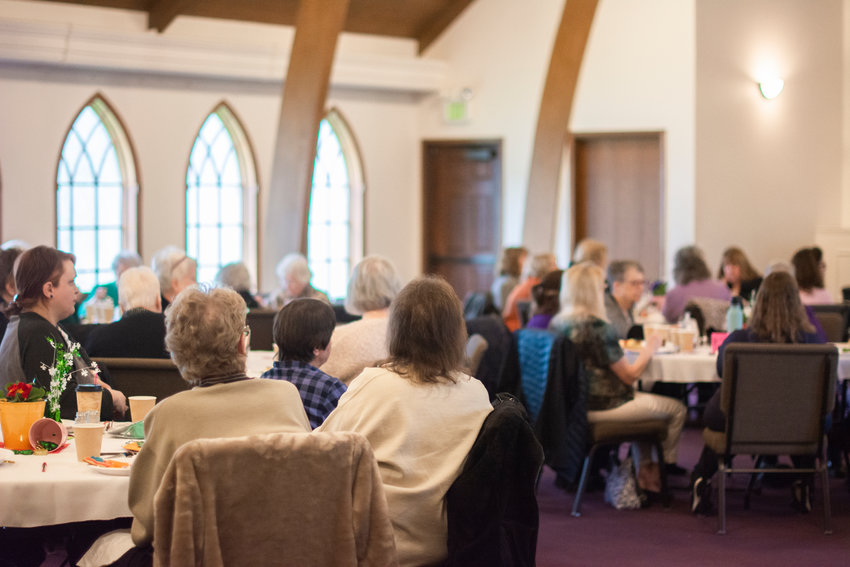 Guests at a Christian Women&rsquo;s Connection luncheon listen to Sheriff Rob Snaza present on safety and scams at the Church of the Nazarene in Centralia in March 2022.