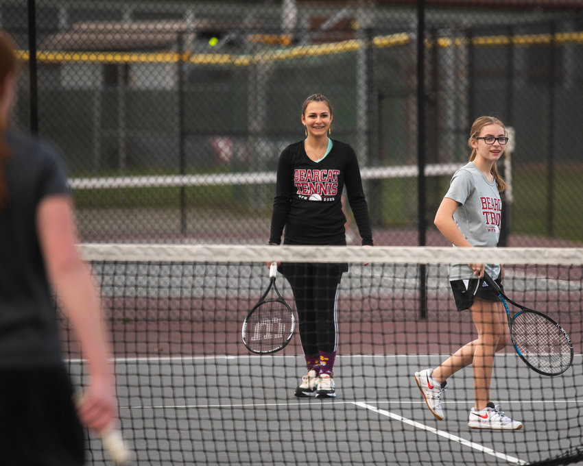 W.F. West's third doubles team, Emma Weerasinghe and Katelyn Wood, smile as they talk to their opponents during a match against Washougal on Wednesday.