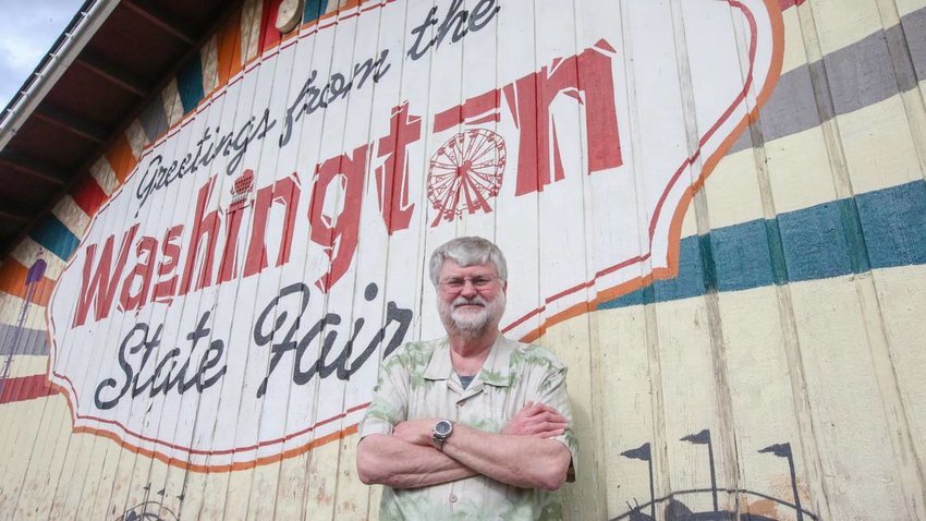 Kent Hojem, chief executive officer for the Washington State Fair, stands in front of a mural at the Puyallup fairgrounds on Tuesday, March 15. Hojem announced his retirement on March 15 through a news release and is expected to retire by the end of 2022.