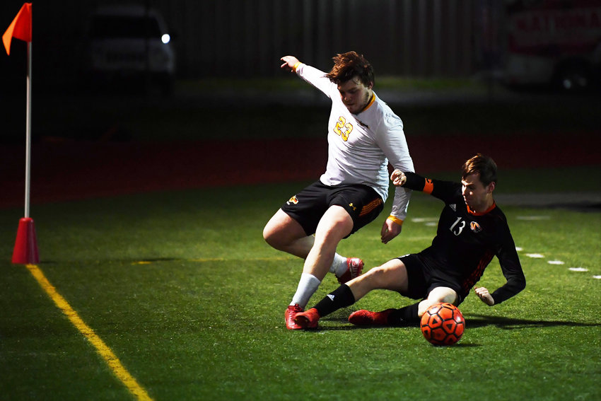 United's Nolan Swofford (23) fights for possession against Centralia's Steven Neely (13) during a non-league game in Centralia on Thursday.