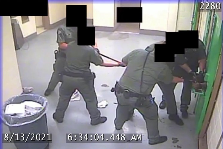 Correction deputies work to remove handcuffs from an inmate during an Aug. 13 incident at the Clark County Jail which is being investigated for &ldquo;potentially criminal&rdquo; use of force.&nbsp;