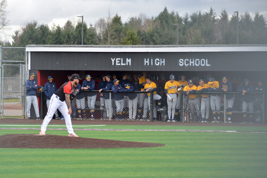 Saint Martin's starting pitcher Zach Alcos prepares to deliver a pitch at Yelm High School on March 18. The team played on the district's new turf during a game against Montana State University.