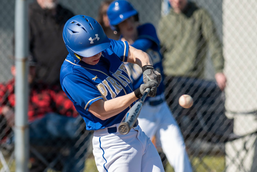 Adna's Nate Scheuber lines up a Winlock pitch during a home doubleheader on Tuesday, March 22.