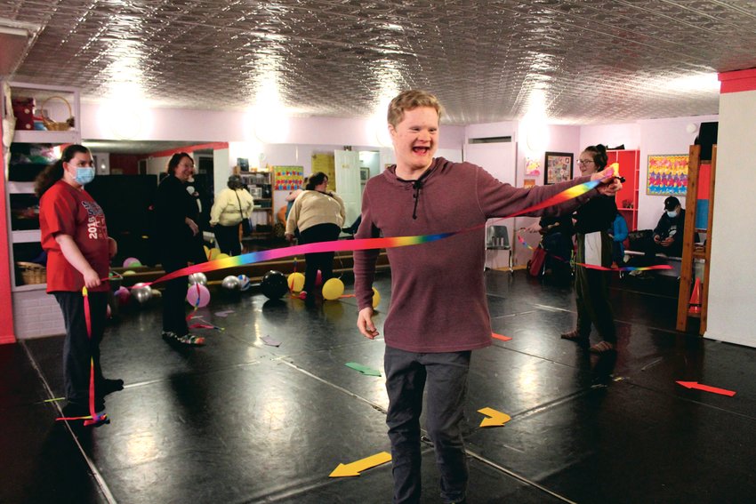 Solomon Geis of Glenoma spins with a ribbon during the all-abilities teen and adult class at Southwest Washington Dance Center while classmate Kayla Davis of Ethel and teachers Rachel and Lizzy March look on.
