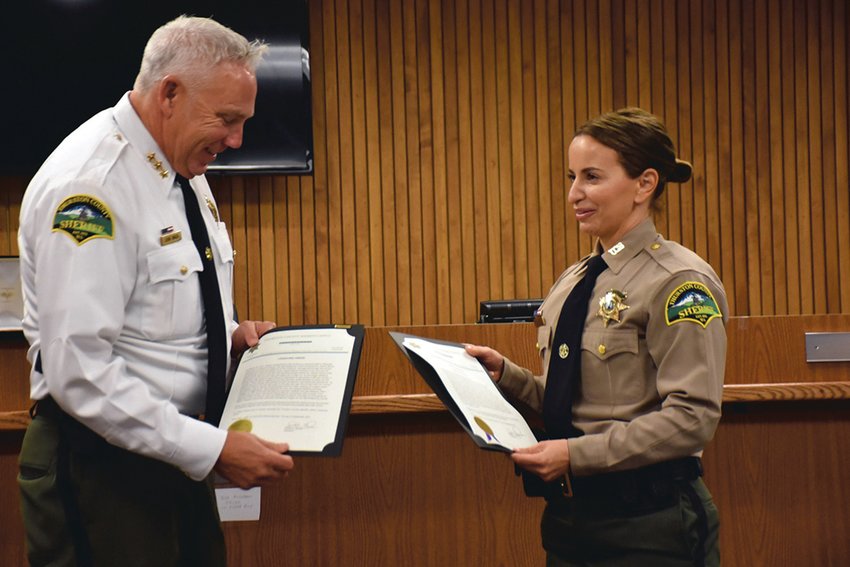 FILE PHOTO &mdash;&nbsp;Thurston County Sheriff John Snaza presents a lifesaving award to Thurston County Deputy Andrea Moore, of Yelm, on Friday, Sept. 17, at the Thurston County Courthouse. She was stabbed by Ronald Clayton in Yelm while responding to a call.