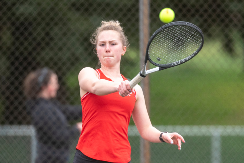 Tenino's No. 1 singles player Megan Letts returns a serve from an Eatonville player during a home match on March 29.