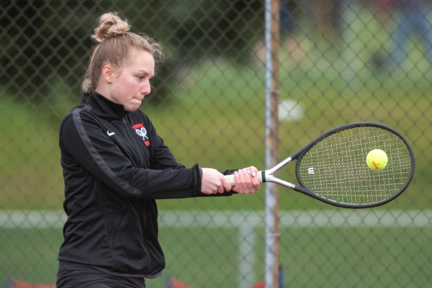 Tenino's No. 1 singles player Megan Letts returns an Eatonville serve during a home match on March 29.