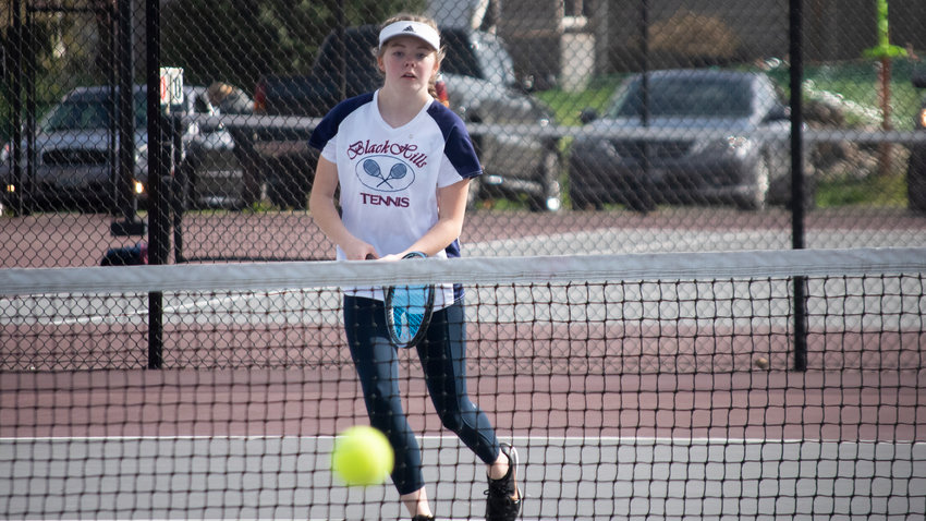 Black Hills&rsquo; second doubles player Chloe Whitcraft watches the ball during a match at W.F. West on Wednesday afternoon.