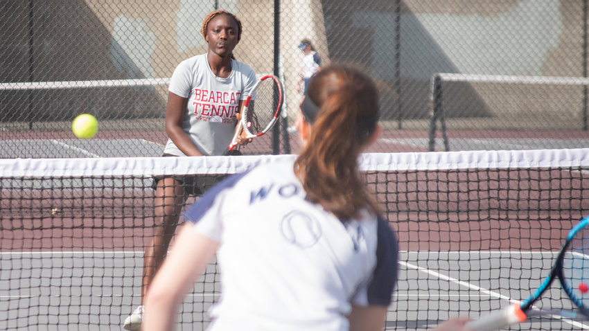 W.F. West first doubles player Mariama Ceesay watches as  Black Hills first doubles player Athena Moore prepares to hit  a forehand in a match in Chehalis on Wednesday.
