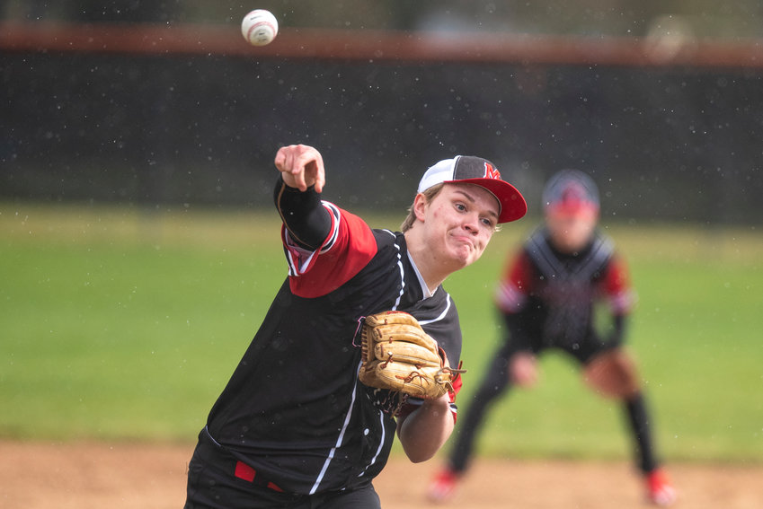 Mossyrock's Jake Comer delivers a pitch to Napavine during a non-league road game on March 31.