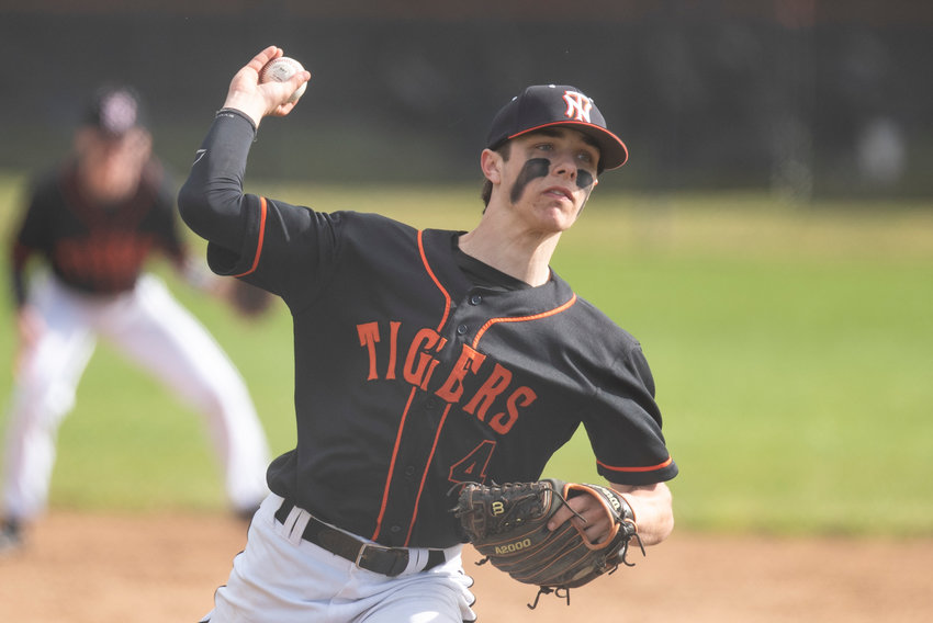 Napavine's Ashton Demarest winds up to deliver a pitch to Mossyrock during a non-league home game on March 31.
