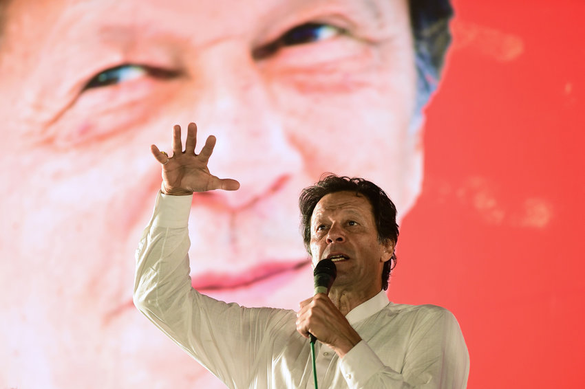 In this photo from July 21, 2018, Pakistani cricket star-turned-politician and head of the Pakistan Tehreek-e-Insaf (PTI) Imran Khan addresses a political campaign rally ahead of the general election in Islamabad. Khan calls for a fresh election after one of his political allies abruptly scrapped a no-confidence vote. (FAROOQ NAEEM/AFP via Getty Images/TNS)