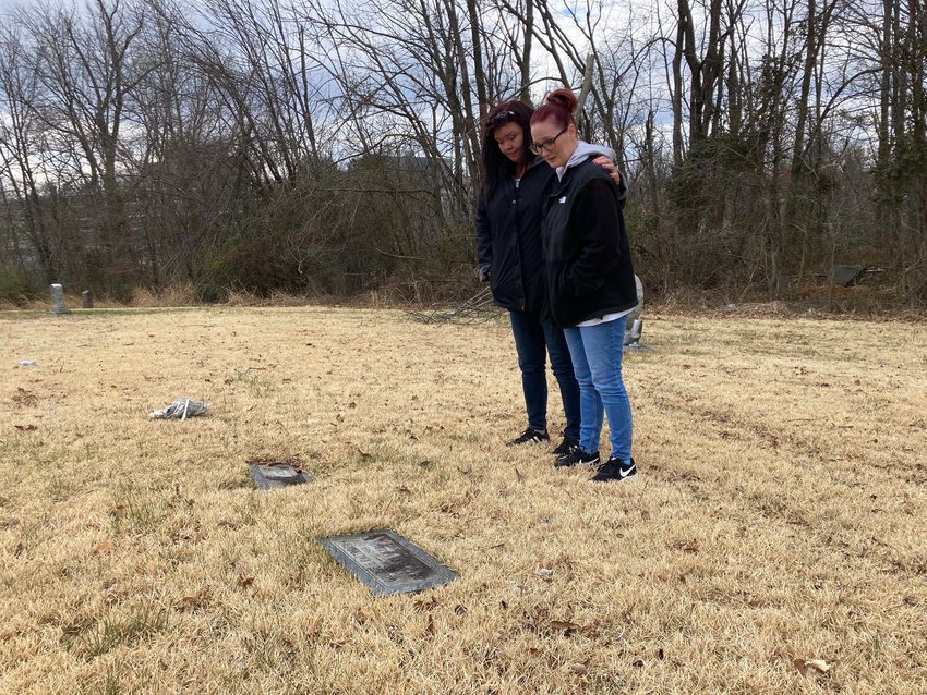 Tammy Brown and Nikki Royster stand at the grave of their mother, Peggy Anne Fishbaugh, whose death in 1972 &quot;baffled&quot; Baltimore County Police. (Christina Tkacik/Baltimore Sun/TNS)