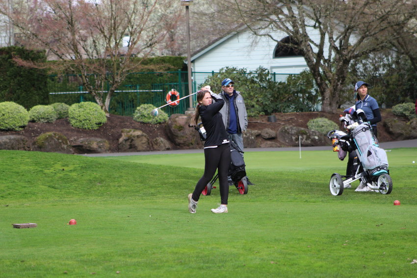 Brooklyn Gaston watches the ball fly after she hits it during her game at Fairway Village in Hockinson.