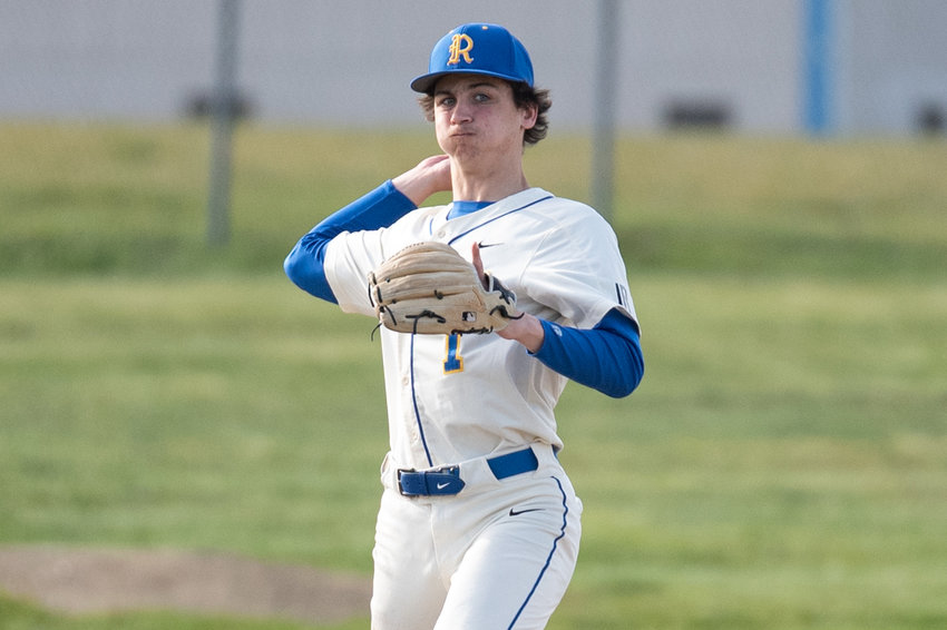 Rochester third baseman Tony Groninger makes a throw to first against Shelton April 7.