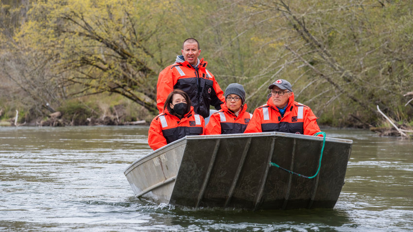 Willie Frank III guides U.S. Senator Maria Cantwell, U.S. Representative Marilyn Strickland, and Governor Jay Inslee along the Nisqually River on Monday.