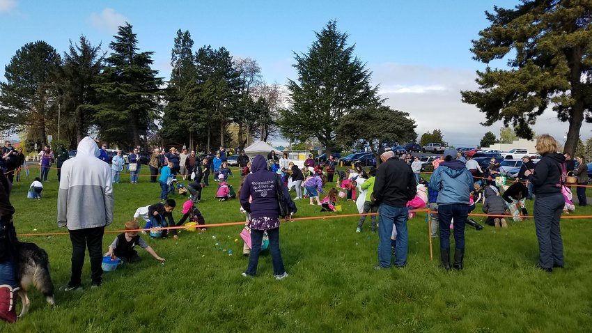 A group of children and their families take part in the community Easter Egg hunt held at Horseshoe Lake Park in Woodland in 2019.