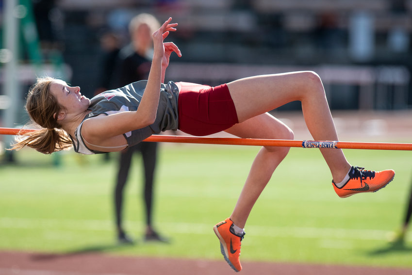 W.F. West's Katelynn Guenther clears the bar in the girls high jump during a rivalry meet at Centralia on April 19.