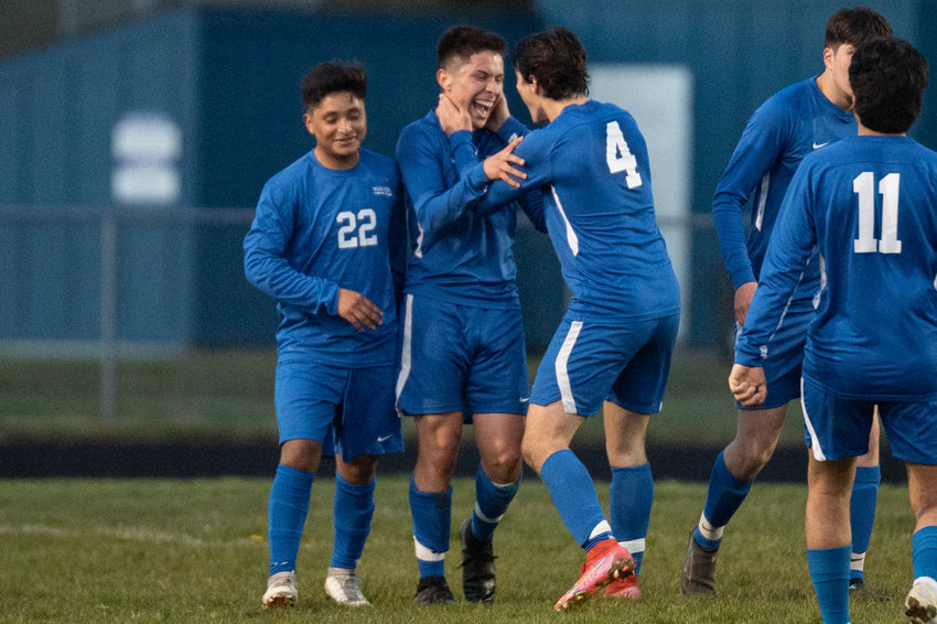 Rochester's Alexis Castillo-Corona celebrates with his team after a penalty kick goal against W.F. West April 19.