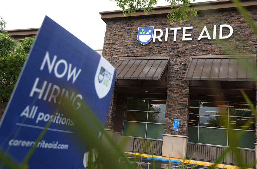 A &quot;now hiring&quot; sign is posted in front of a Rite Aid store on April 14, 2022, in San Rafael, California. (Justin Sullivan/Getty Images/TNS)