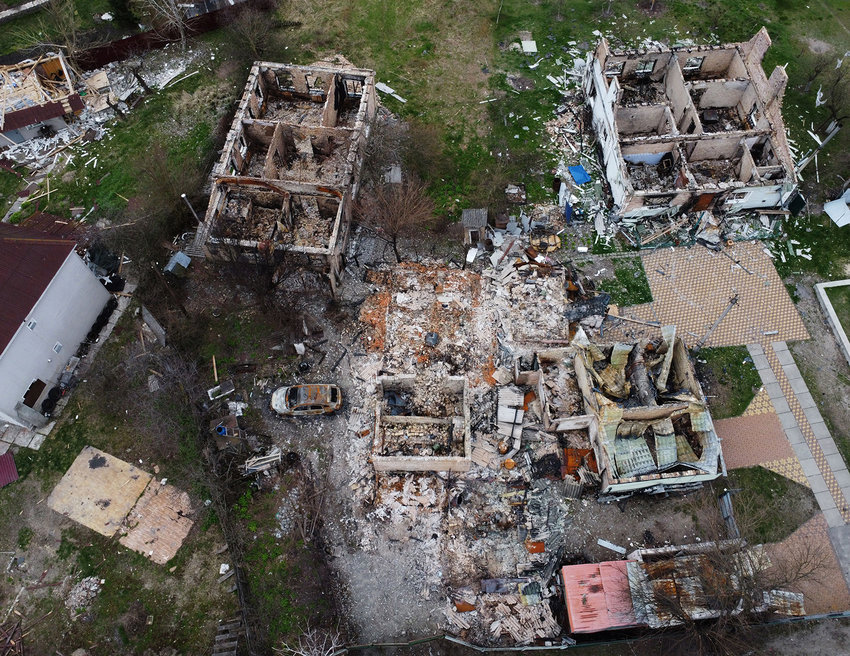This aerial view shows a destroyed residential area in the village of Moshchun, northwest of Kyiv, Ukraine, on April 20, 2022, as more than 5 million Ukrainians have now fled their country following the Russian invasion, the United Nations says. (Genya Savilov/AFP via Getty Images/TNS)