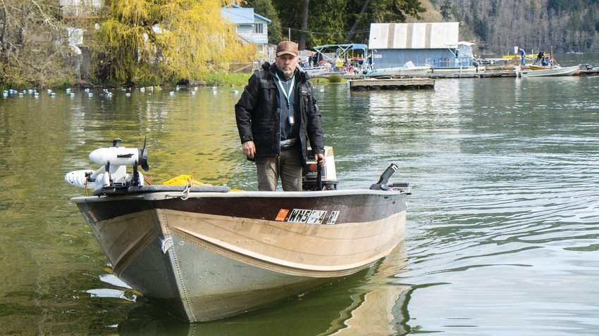A participant in the Mineral Lake Fishing Derby pilots his boat back to a dock in 2022.
