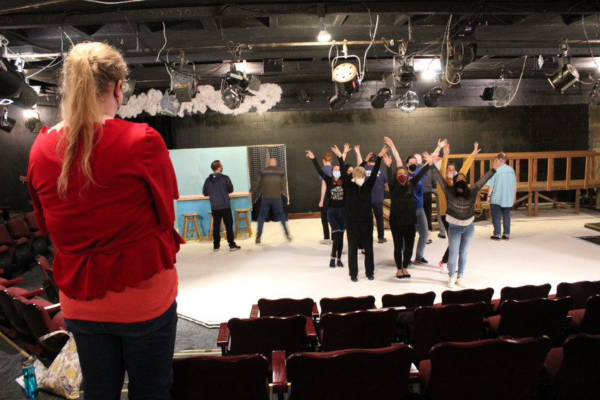 Director Emilie Brown watches the cast of &quot;Mamma Mia!&quot; rehearse a dance scene on a recent evening. &quot;Mamma Mia&quot; opens at the Evergreen Playhouse in Centralia on May 6.
