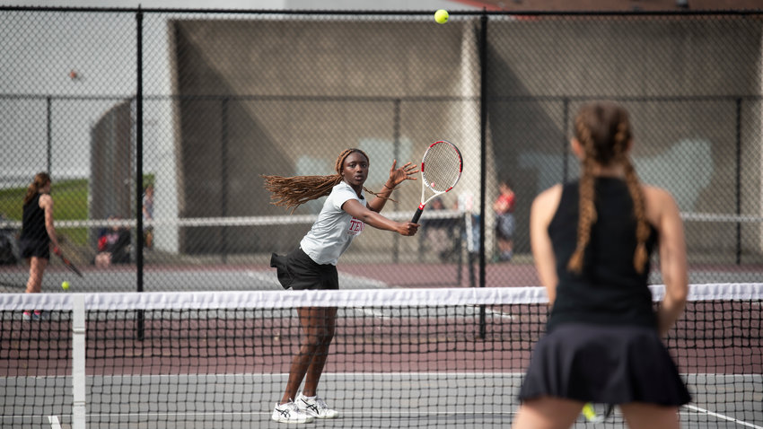 Mariama Ceesay, first doubles player for W.F. West, hits a backhand volley against Centralia&rsquo;s Maddie Corwin at W.F. West on Friday.