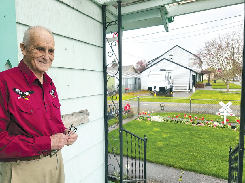 Robert McInnis stands on his porch in the Edison District next to a sign reading &ldquo;Once a Marine, Always a Marine.&rdquo;