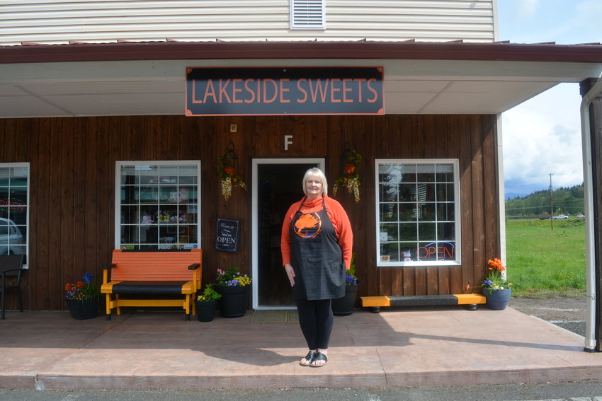 Chris Bottemiller stands in front of her new candy store, Lakeside Sweets, in Woodland on April 28.