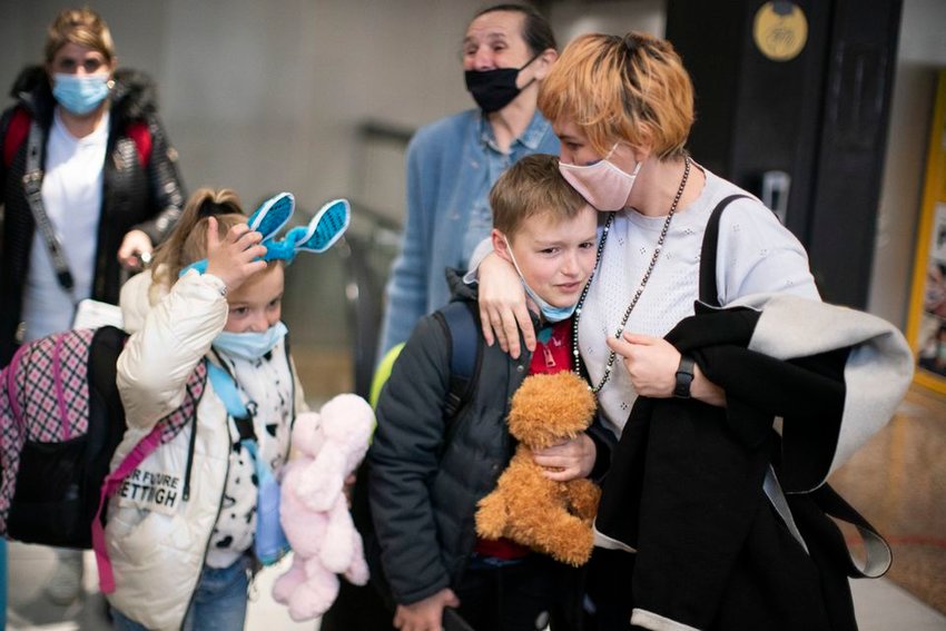 Natalia Shudruk embraces her nephew, Yaryk, 9, upon his arrival at the Seattle-Tacoma International Airport in Seattle, Washington. April 16, 2022 Beth Nakamura/Staff