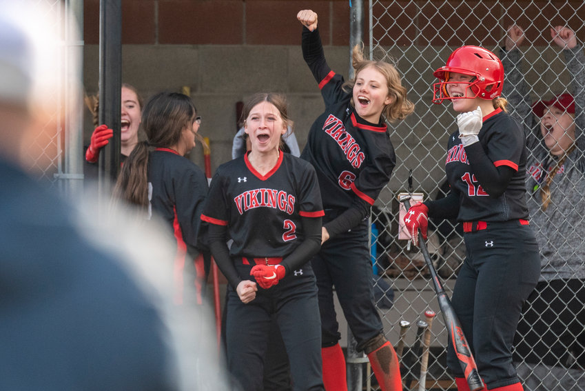 Mossyrock's Abbie Lovan (2), Addison Barrows (6) and Delaney Marshall (12) yell in celebration after the Vikings walk-off Naselle, 11-10, to win the 1B Columbia Valley League title at home on Monday, May 9.