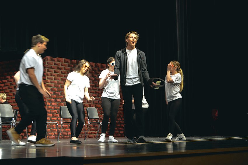 Connor McCormick, flanked by A.J. Hicks, Maiya Mohrweis, Jaden Lawrence-Olsen and Charlease Hyder, takes the lead during a song in the Yelm Drama Club's performance of &quot;Working.&quot;
