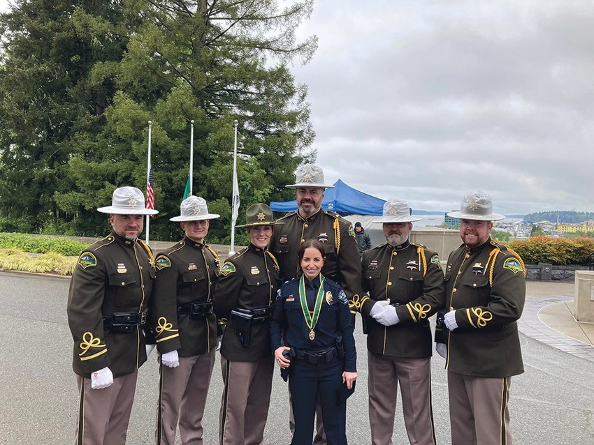 Former Thurston County Deputy Andrea Moore, center, is pictured on May 6 at the Washington State Law Enforcement Medal of Honor and Peace Officers Memorial Ceremony.