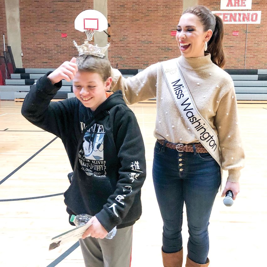 Miss Washington Maddie Louder crowns a student during a visit to the Tenino School District on Tuesday. &ldquo;A full day at Tenino Middle School talking about stress, anxiety and coping,&rdquo; she wrote after the event.  &ldquo;Thanks for having me, Tenino!&rdquo;