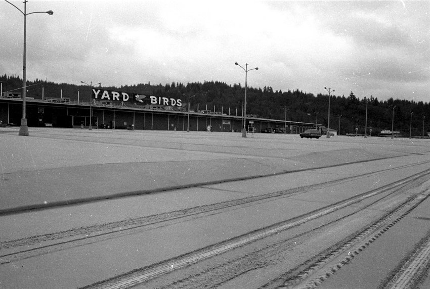 The Yard Birds parking lot was covered in ash from the eruption of Mount St. Helens in this photograph from May 26, 1980.