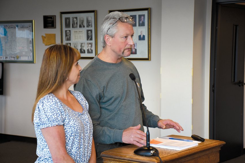Kevin and Melody Hicks, who are planning to build an RV park behind the Security State Bank lot on National Avenue in Chehalis, give public comment at Monday&rsquo;s Chehalis City Council meeting, expressing concern over the city&rsquo;s blanket traffic impact analysis requirement, which they say is hampering the progression of their planned development.