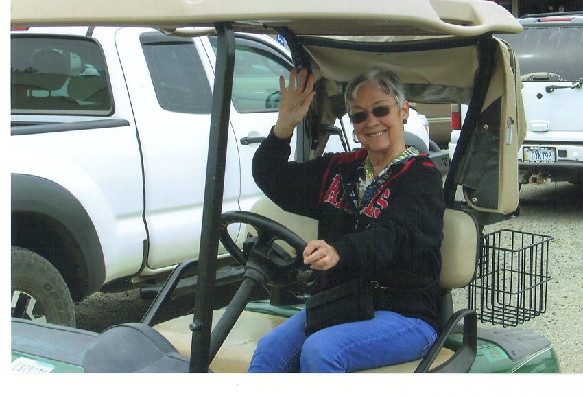 Former Reflector advertising director Darlene Carr drives a golf cart in an undated photo