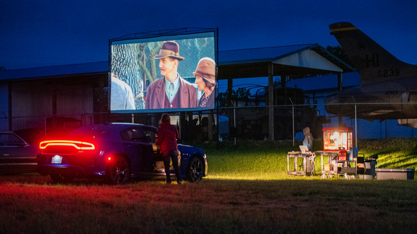 Vehicles park as popcorn is served in Chehalis while the movie &ldquo;Seabiscuit&rdquo; plays outside the Veterans Memorial Museum earlier this month.
