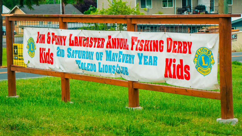A sign for the Jim and Penny Lancaster Annual Kids Fishing Derby put on by the Toledo Lions Club at South Lewis County Park is pictured last year.