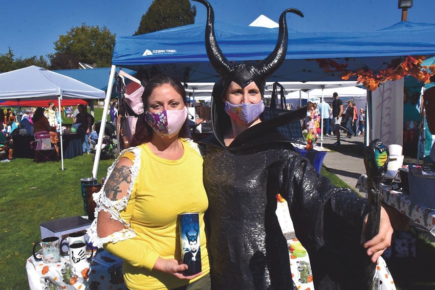 Stephanie Blose, as Maleficent, smiles with Brandy Totman at a Yelm Fall Harvest Festival at Yelm City Park.