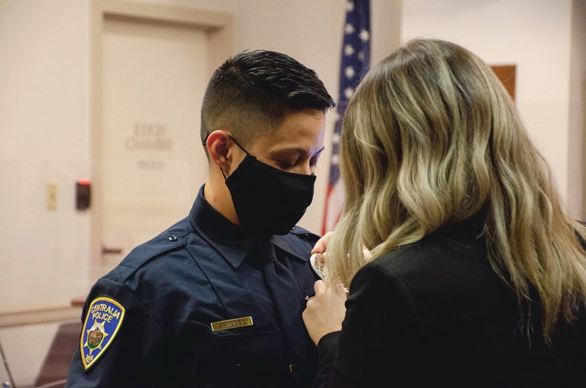 Winlock native Julie Jacobo was sworn in as an officer with the Centralia Police Department during a January Centralia City Council meeting. She read the Law Enforcement Code of Ethics and her oath of office was administered by police Chief Stacy Denham. Shortly after, Jacobo&rsquo;s badge was ceremonially pinned to her uniform by wife Kalyn Jacobo. Jacobo comes to the job with five years of law enforcement experience, mostly with Lewis County Sheriff&rsquo;s Office and Lewis County corrections. She also has experience as a SWAT team member, Swiftwater Rescue Team member, Lewis County JNET detective and a general investigations detective. &ldquo;In this case, it became very clear to me that Officer Jacobo has an impeccable reputation, she&rsquo;s a hard worker, is accountable, ethical and a very determined individual,&rdquo; Denham said, adding that it was an &ldquo;extremely easy&rdquo; decision to hire her. According to Denham, Jacobo enjoys spending time with her wife and two sons, hiking, working out, playing in the snow and swimming.