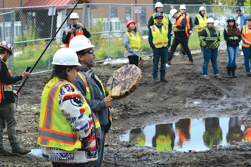 Nisqually Tribe elders Cleo Frank and Hanford McCloud sing a ceremonial song on May 19 at the tribe&rsquo;s under construction Elder Center.