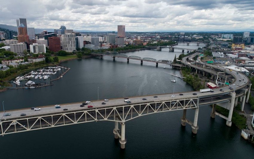 An aerial view, facing south, of the Marquam, Hawthorne and Morrison bridges during the evening rush hour on Wed., May 13, 2020.  Traffic, which had dramatically decreased in the early days Oregon's stay-at-home order, seems to have picked back up recently.  Dave Killen / Staff