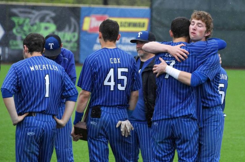 Members of the Toutle Lake baseball team hug after their 7-6 loss to Brewster in the WIAA 2B baseball championship game in Ridgefield Saturday.