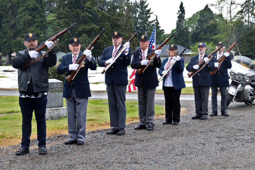 The Honor Guard of American Legion Post 17 fires rounds in a departing salute during the Sticklin Greenwood Memorial Park Rededication Ceremony in Centralia on Saturday.