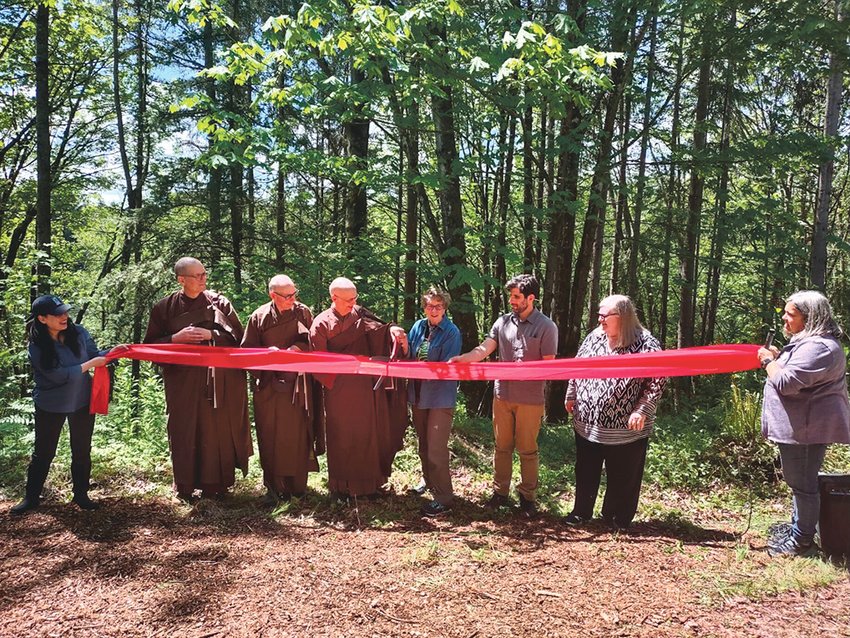 Members of the Nisqually Land Trust and the North Cascades Buddhist Priory held a ribbon-cutting event for a conservation project along the Nisqually River.