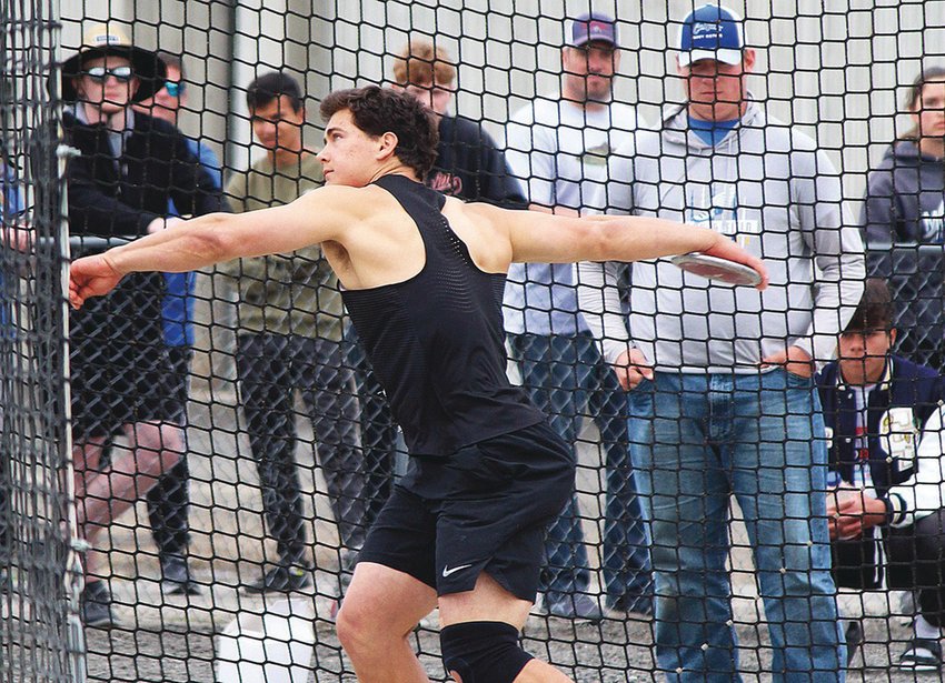 Rainier's Jeremiah Nubbe throws the discus during the State 1B/2B/1A Track and Field Championships in Cheney on Friday, May 27, 2022.