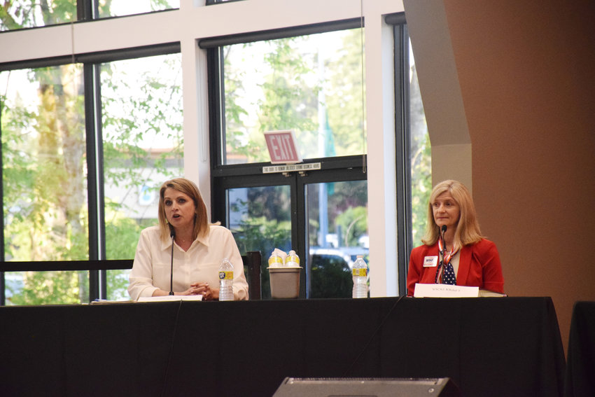 Washington state Third Congressional District candidate Heidi St. John, left, and Vicki Kraft&nbsp; take part in a forum at RV Inn Style Resorts event hall in Hazel Dell May 31.