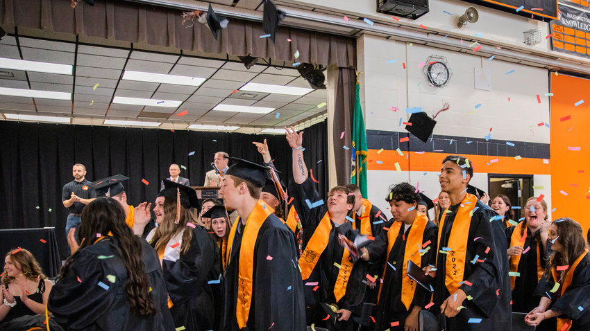 Caps fly as confetti falls on graduates at Napavine High School on Saturday.